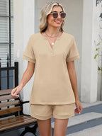 Solid color short sleeve top and shorts two-piece set by Trendsi, casual summer outfit for women, made of comfortable fabric.