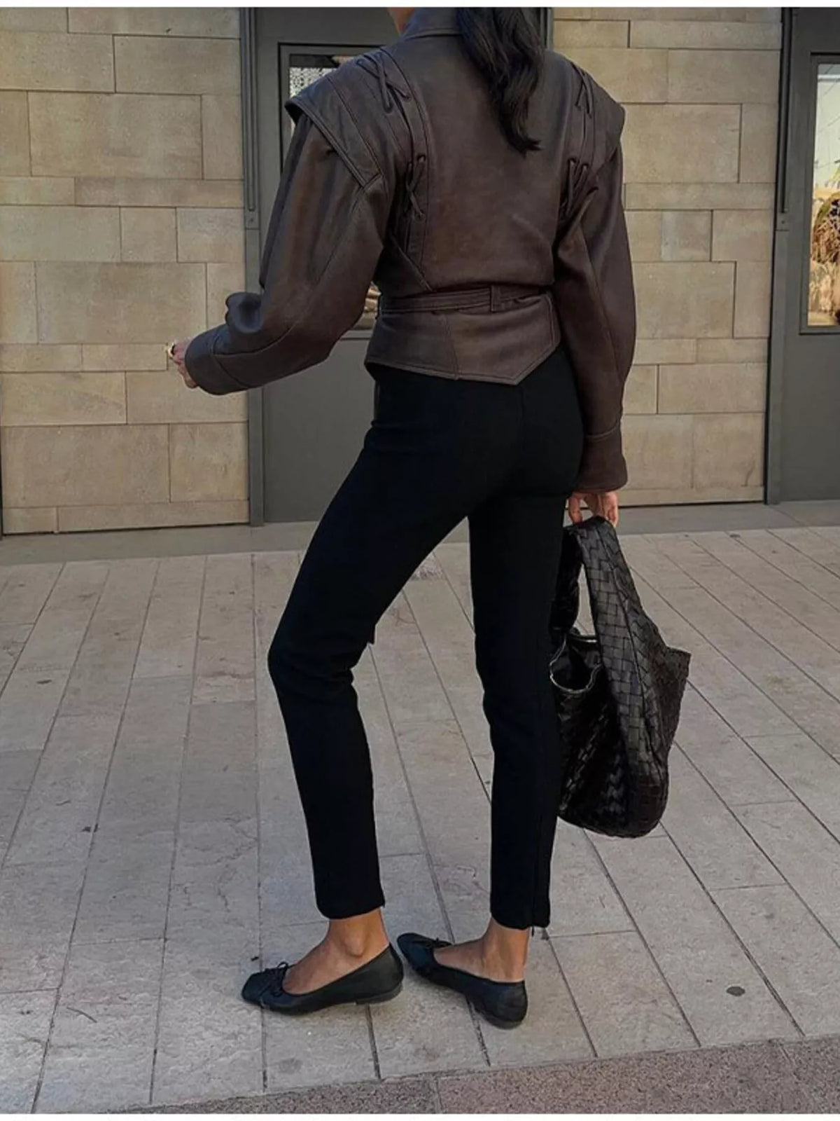 Women's leather belted jacket with shawl collar by Trendsi, featuring a stylish design and classic silhouette.