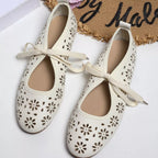 Plush Fashion Hub floral cutout tied slip-on sandals with open toes and decorative floral patterns, perfect for casual summer wear.