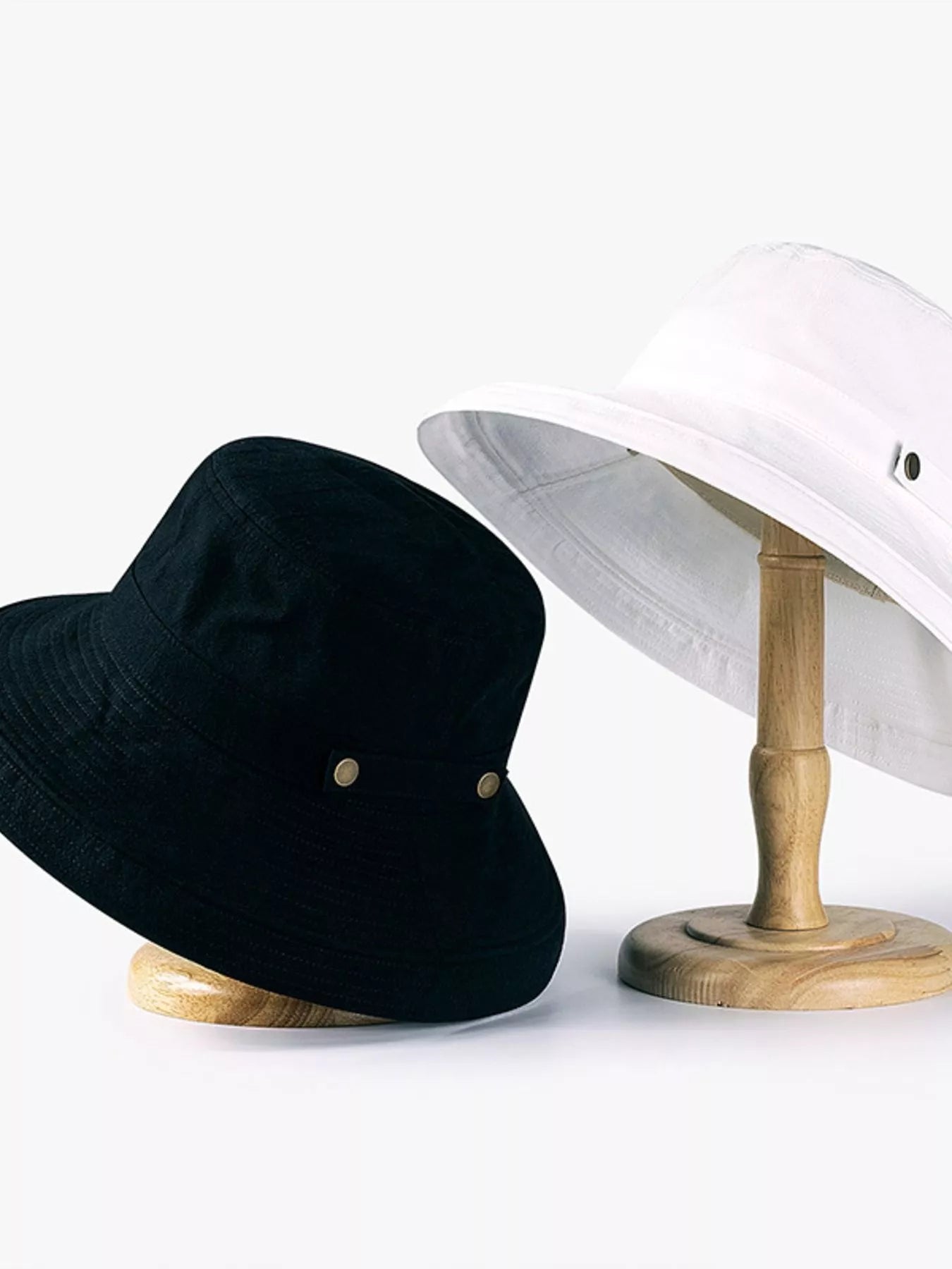 Trendsi classic cotton wide brim sun hat, breathable summer beach accessory, shown on a model with a relaxed outdoor setting.