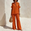 Women's off-shoulder linen blend pantsuit set with short sleeves, featuring a stylish two-piece design from Plush Fashion Hub.