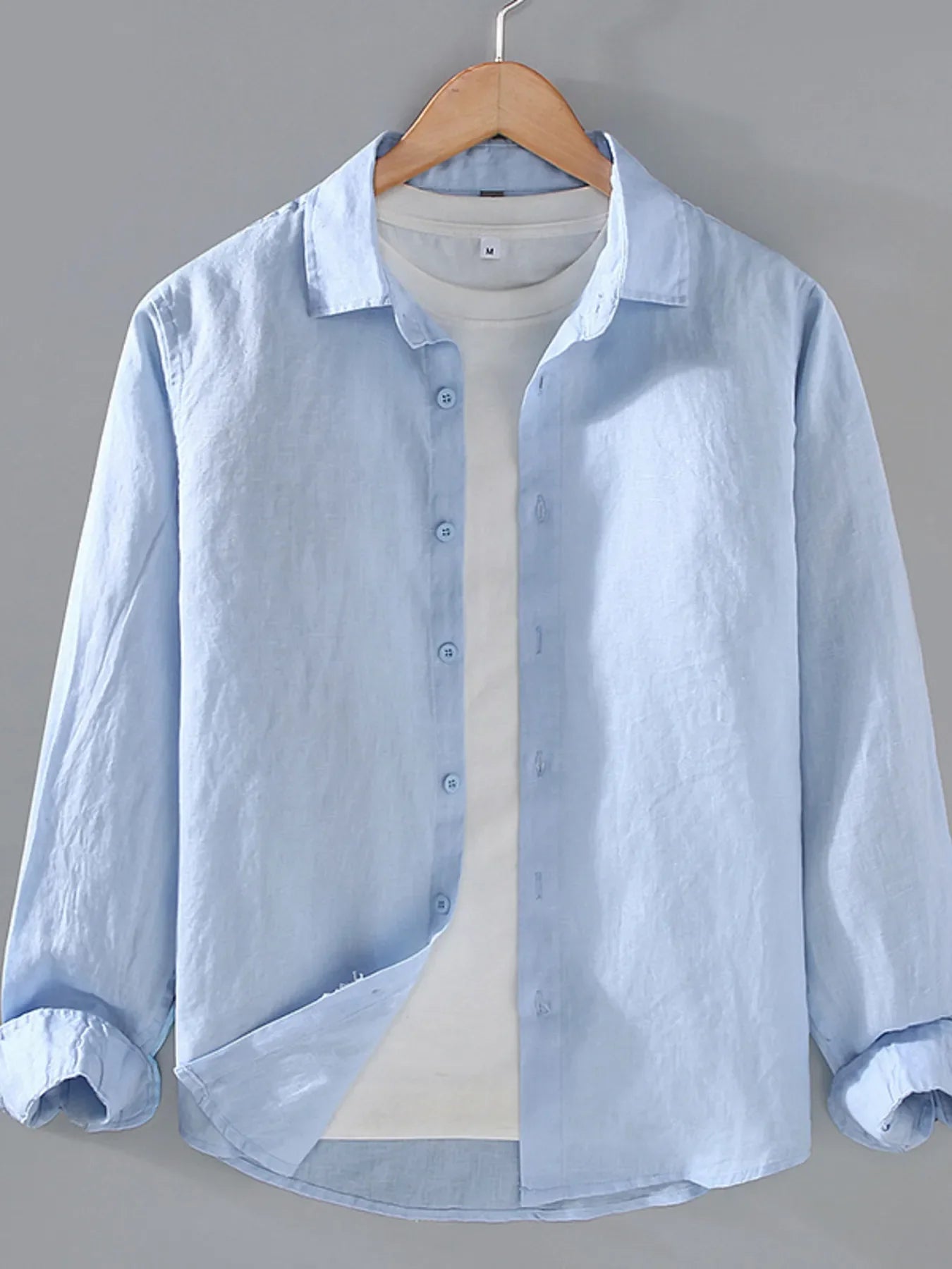 Plus size men's long sleeve button-up shirt from Plush Fashion Hub, featuring a classic collar and chest pocket.