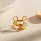 18K gold-plated gemstone open cuff ring with intricate design, featuring colorful gemstones and a sleek, modern look.