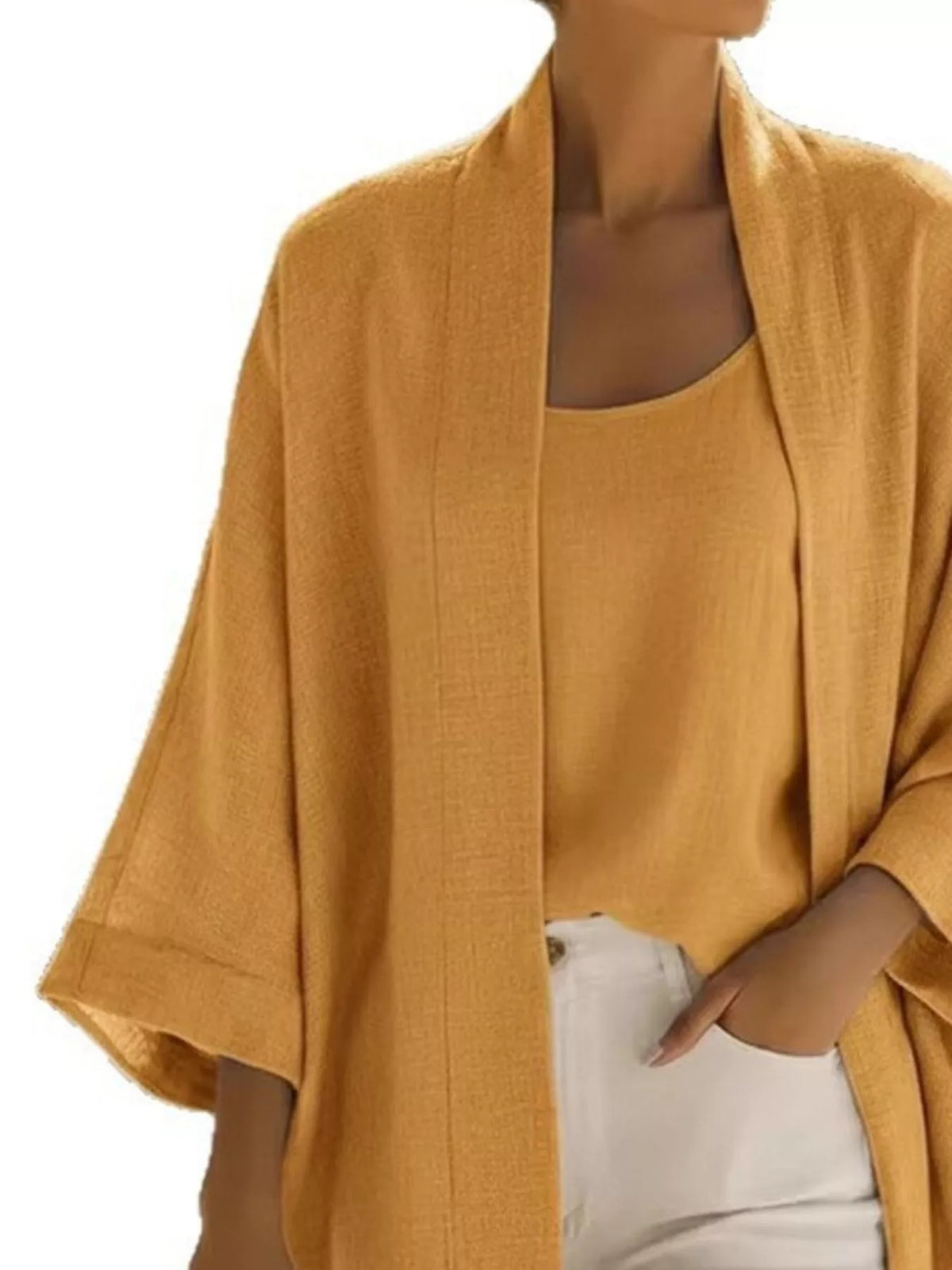 Plus size Trendsi open-front cardigan and matching tank top set, featuring a full size, cozy knit fabric, and stylish layered look.