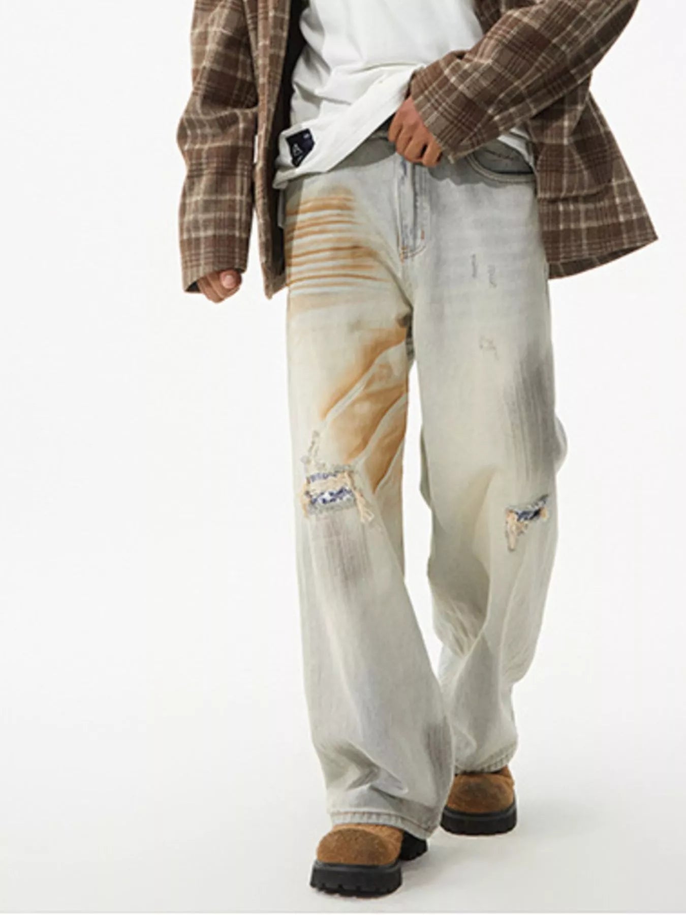 Men's distressed wide leg jeans from Trendsi, showing casual fit with ripped details and relaxed wide leg style.