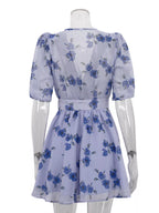 Floral puff sleeve mini dress by Shopimist featuring a fitted bodice, short puffed sleeves, and a flowy skirt in vibrant floral print.