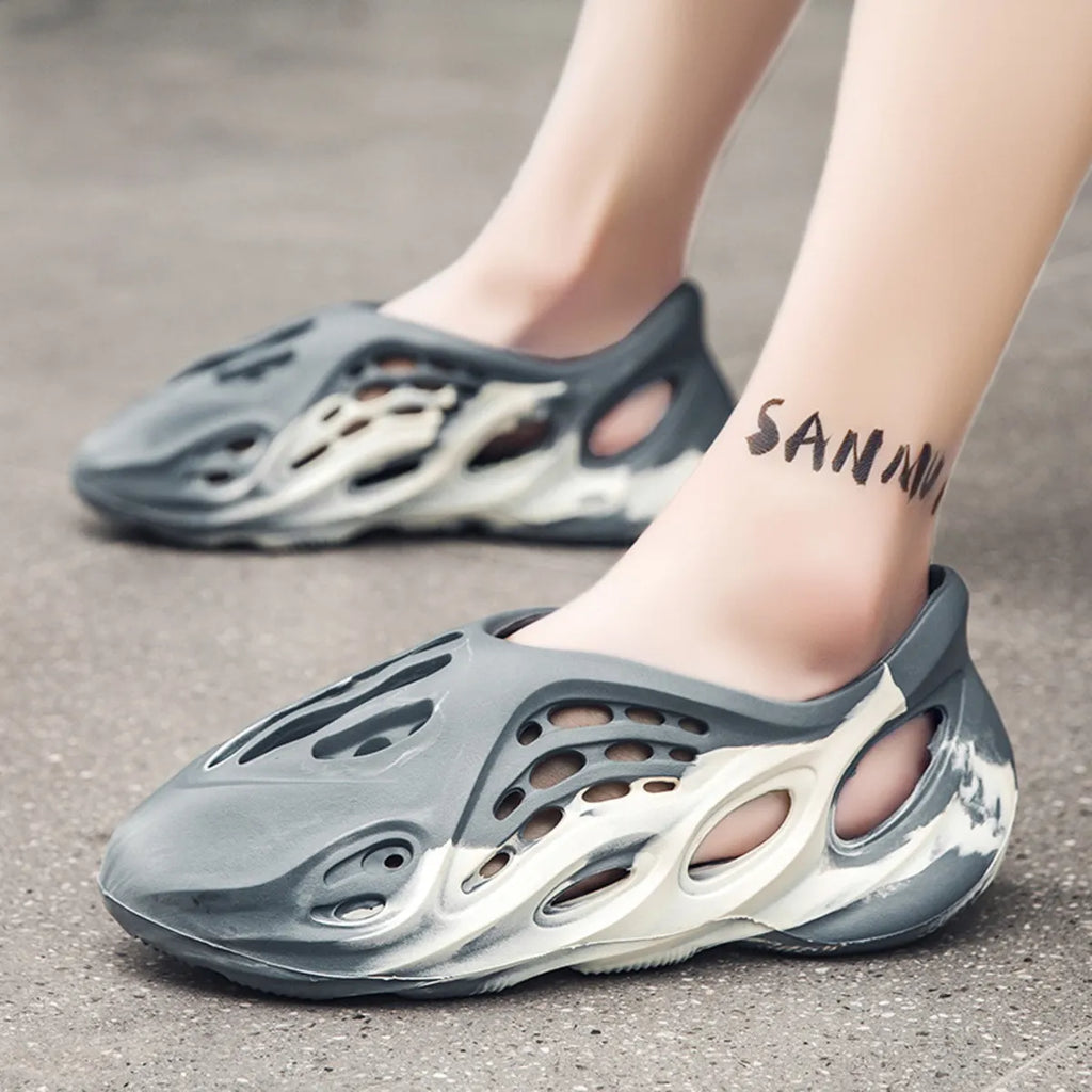 Trendsi hollow-out flat sandals featuring open toes and stylish cut-out design, perfect for casual summer footwear.