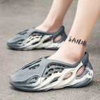 Trendsi hollow-out flat sandals featuring open toes and stylish cut-out design, perfect for casual summer footwear.