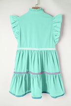 Cotton ruffled notched cap sleeve mini dress by Trendsi featuring a fitted silhouette and stylish design.