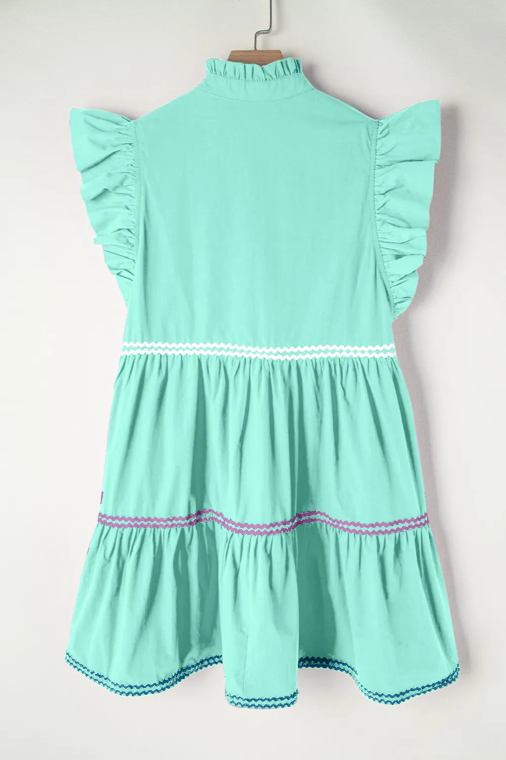 Cotton ruffled notched cap sleeve mini dress by Trendsi featuring a fitted silhouette and stylish design.