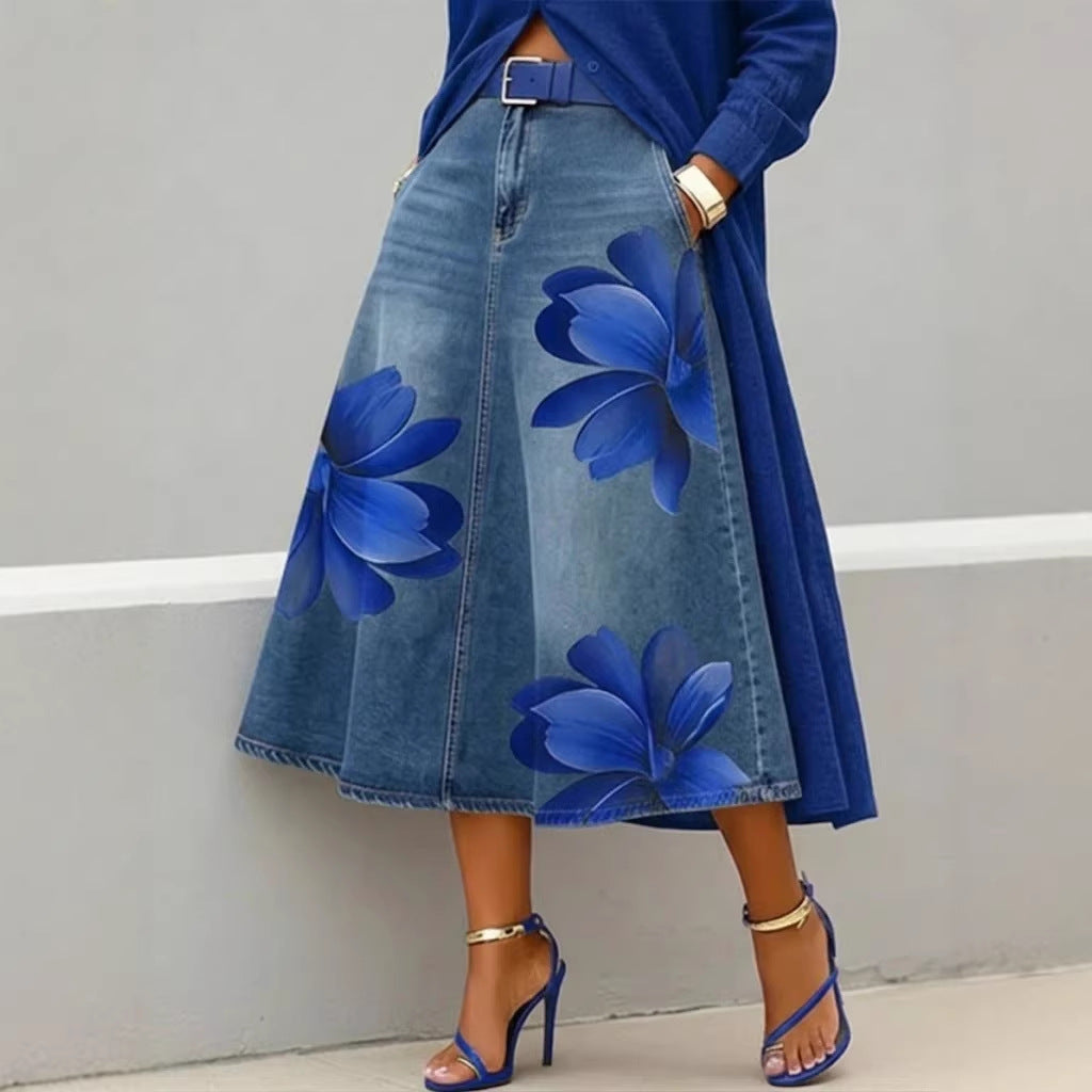 Women's floral print denim-style boho A-line midi skirt by FitiqueFit, featuring a flowy silhouette and colorful floral pattern.