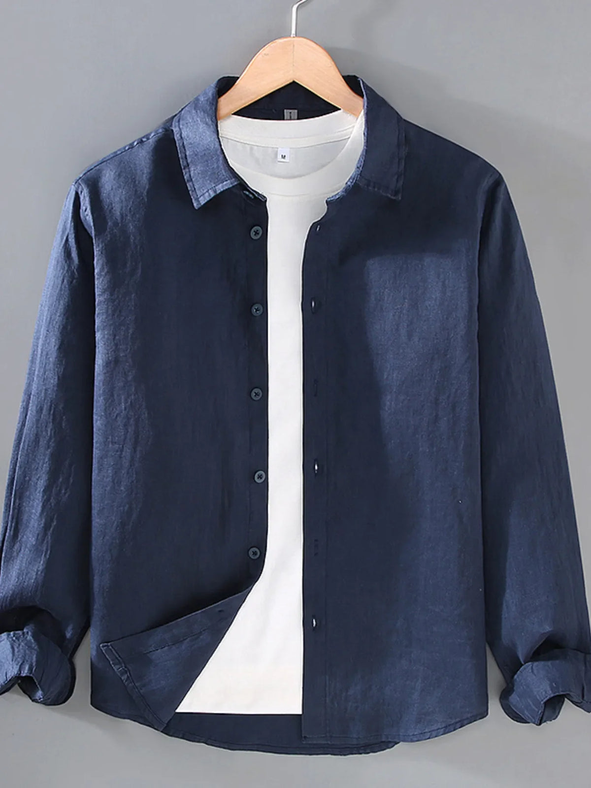 Plus size men's long sleeve button-up shirt by Plush Fashion Hub, shown in a classic design with collar and front buttons.
