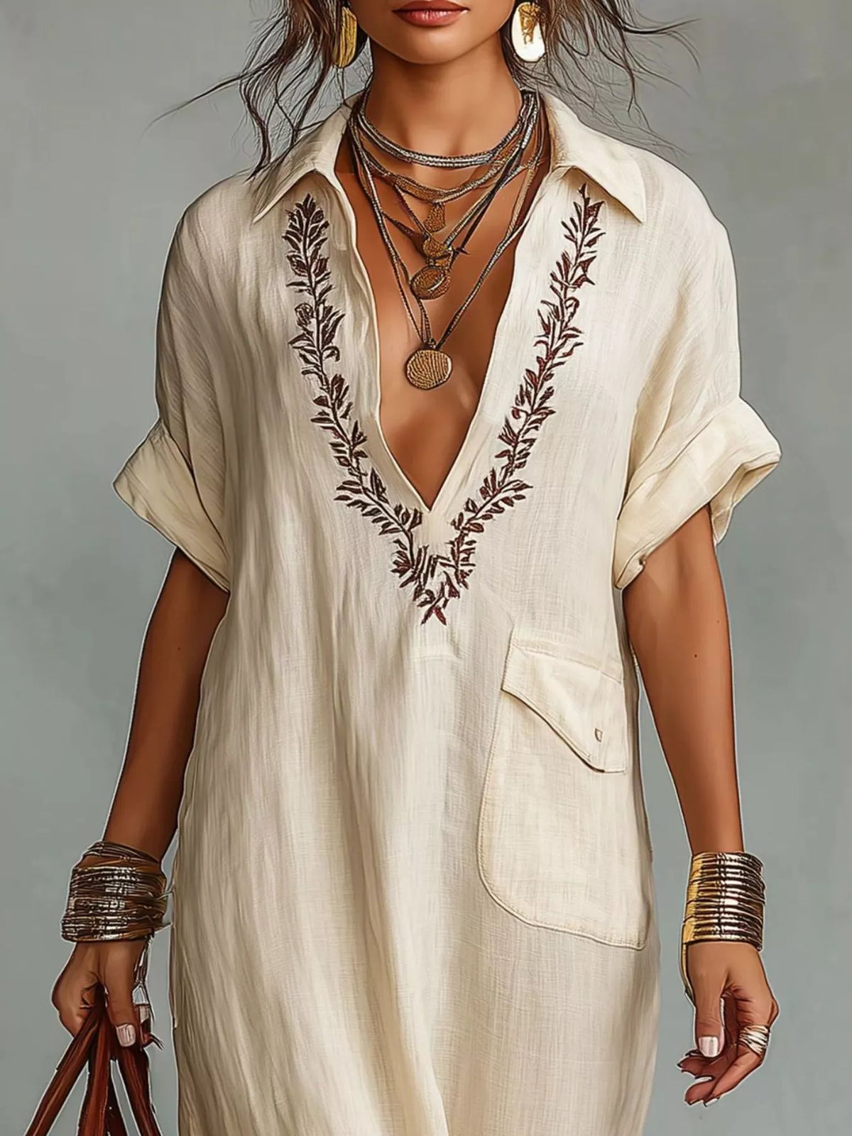 Plus size bohemian embroidered maxi dress with flowing fabric and colorful details, perfect for boho-inspired fashion.