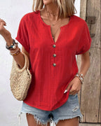 Women's buttoned V-neck short-sleeve T-shirt top by Plush Fashion Hub, featuring a stylish V-neck and button details.