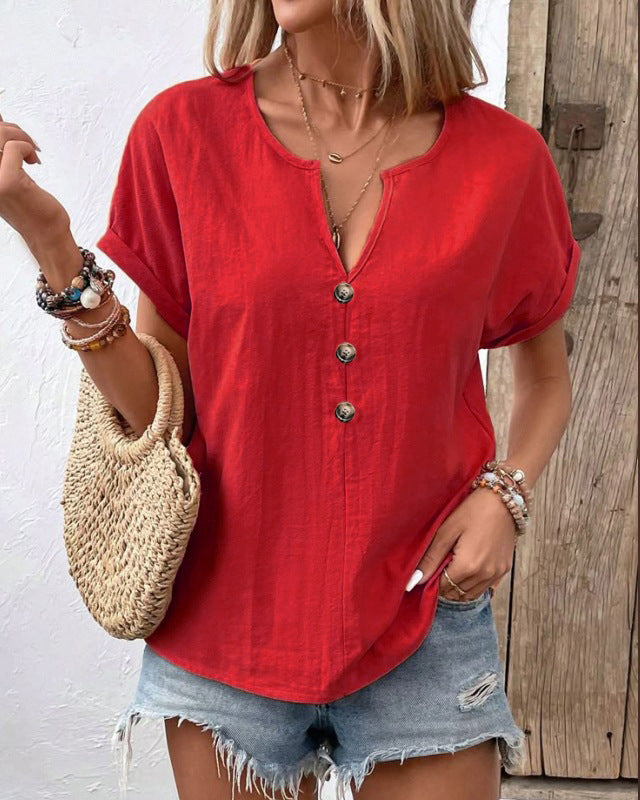 Women's buttoned V-neck short-sleeve T-shirt top by Plush Fashion Hub, featuring a stylish V-neck and button details.