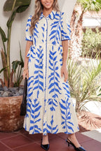 Leafy botanical print side tie button-down maxi dress by Shopimist, featuring a flowy design and vibrant leaf pattern.