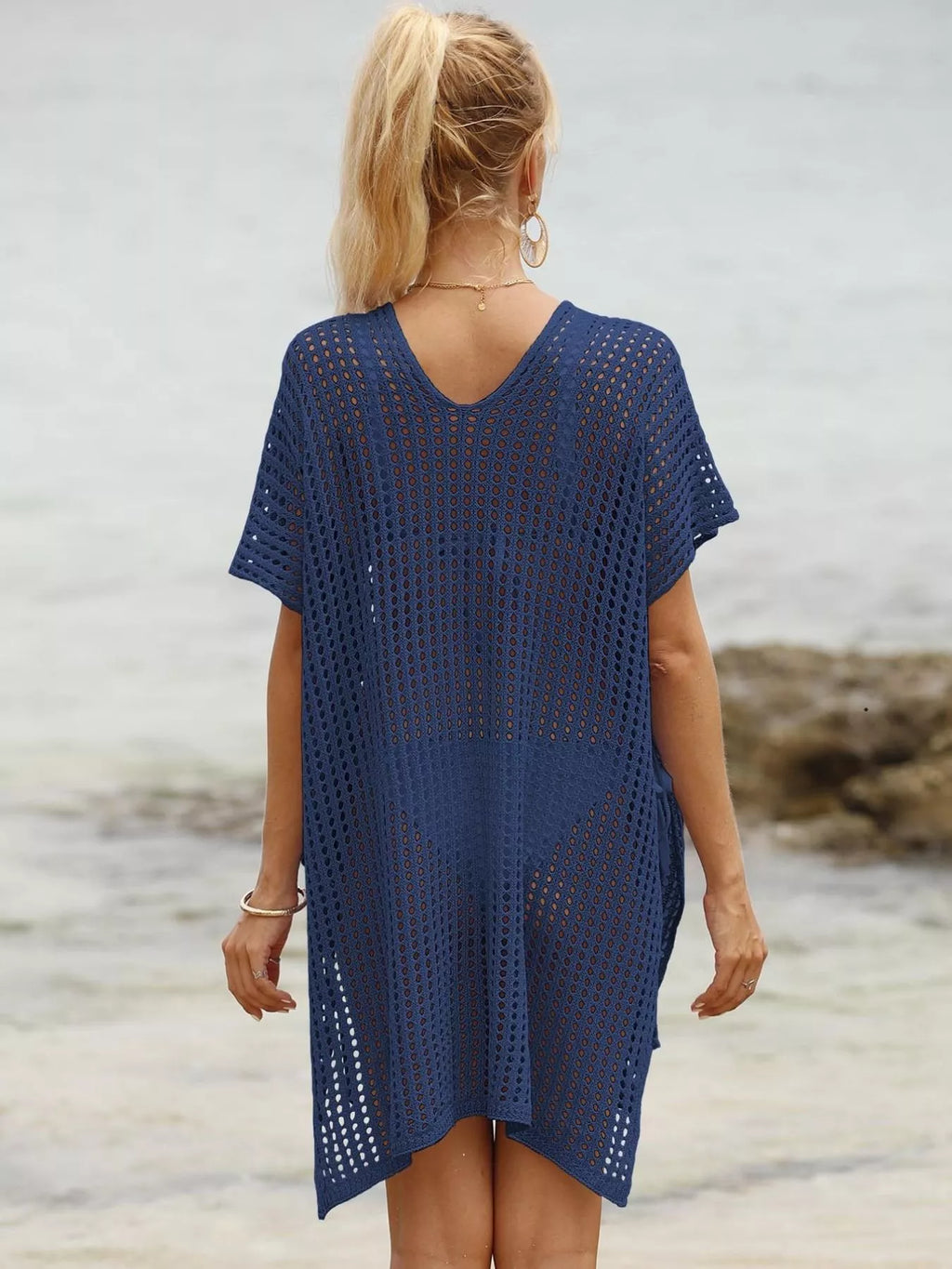 Openwork V-neck slit cover-up from Trendsi featuring lightweight fabric and stylish design for beach or poolside wear.