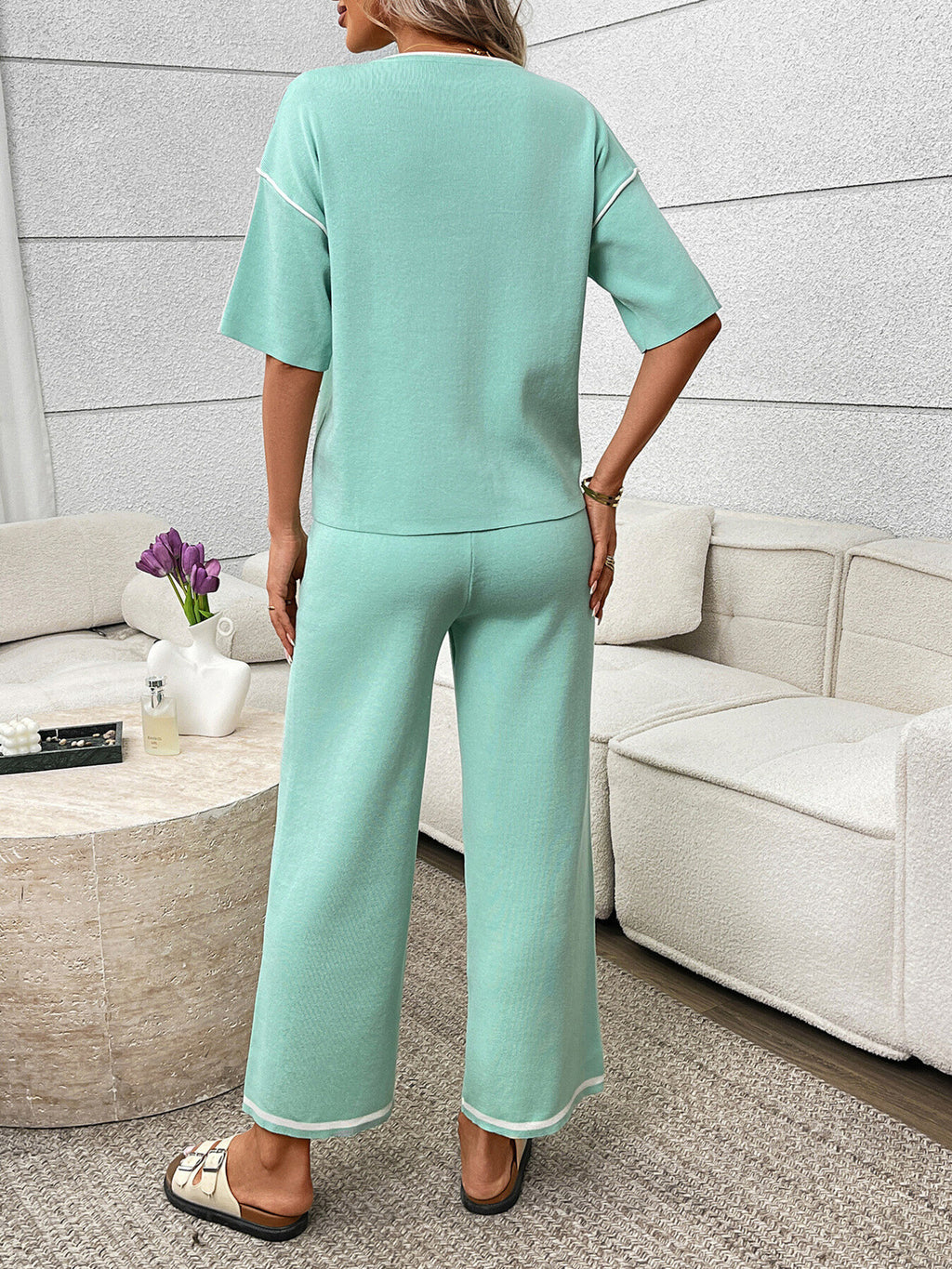Women's casual two-piece lounge set with round neck top and drawstring pants by Trendsi, shown in comfortable, relaxed fit.