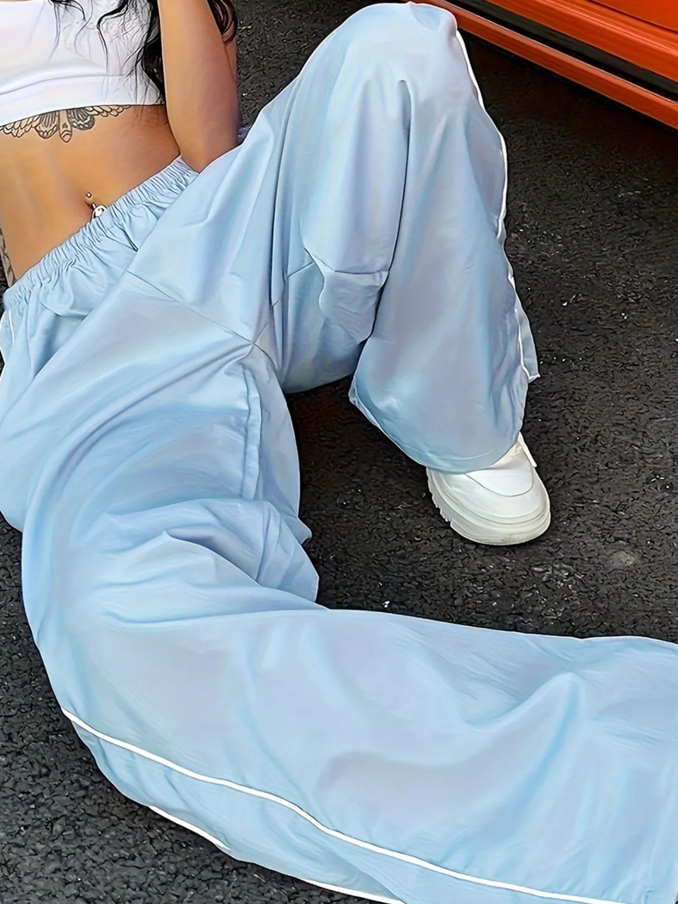 Women's high-rise wide-leg lightweight dress pants with elastic waist, stylish and comfortable trousers by Trendsi.