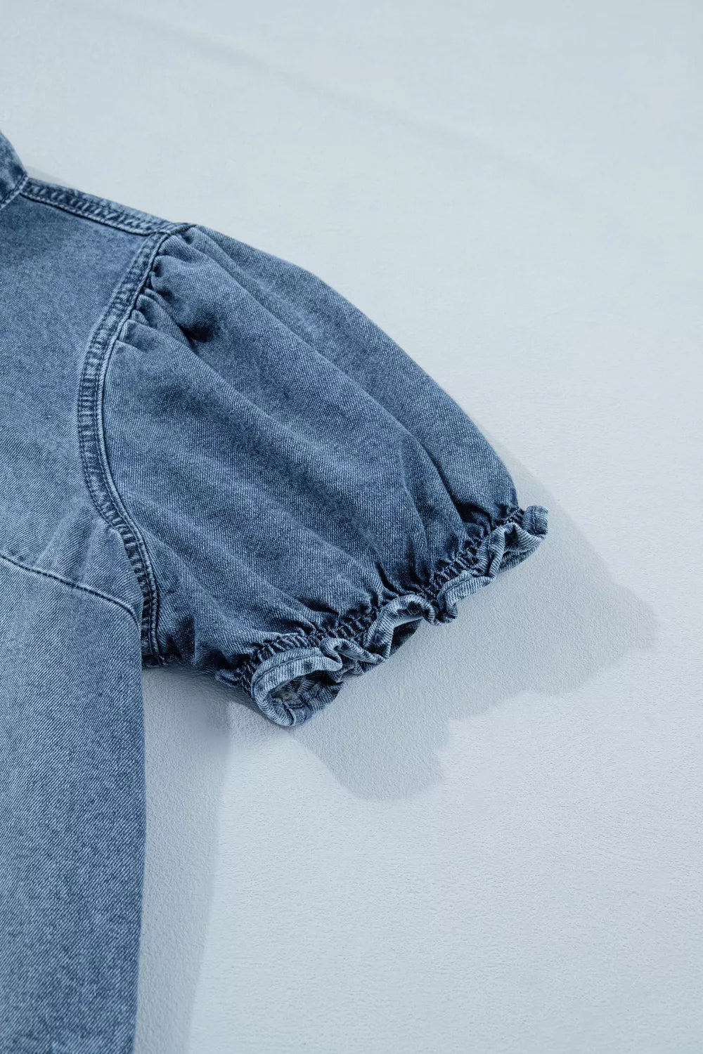Plush Fashion Hub frilled short sleeve denim shirt with snap buttons, featuring a stylish, casual design and frilled details.