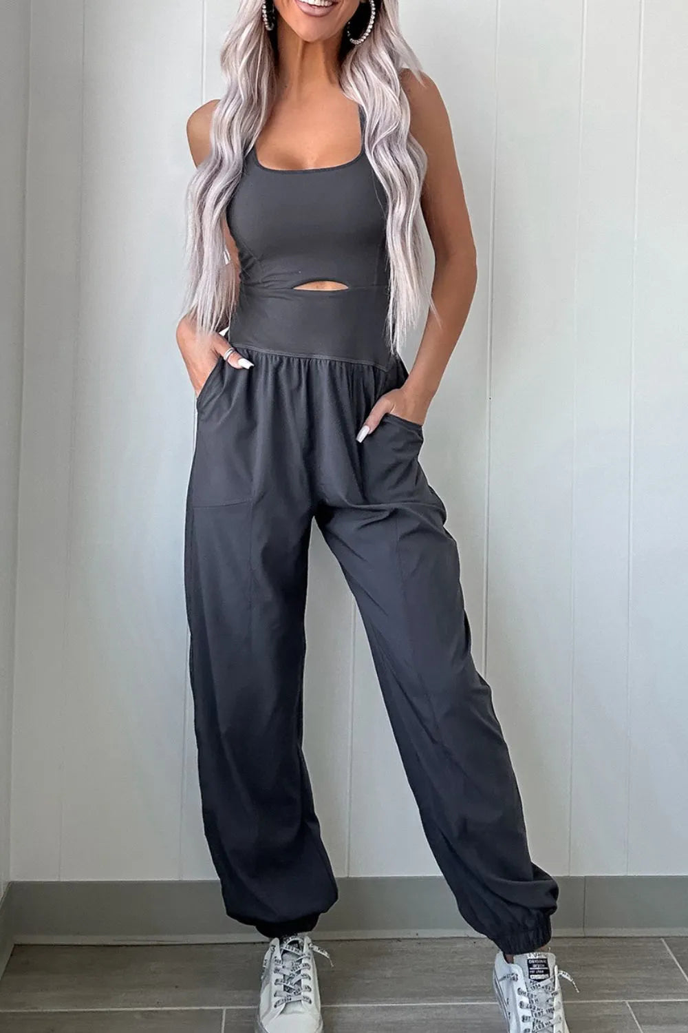 Cutout square neck wide strap active jumpsuit by Plush Fashion Hub, featuring a fitted design and sleeveless style for workout wear.