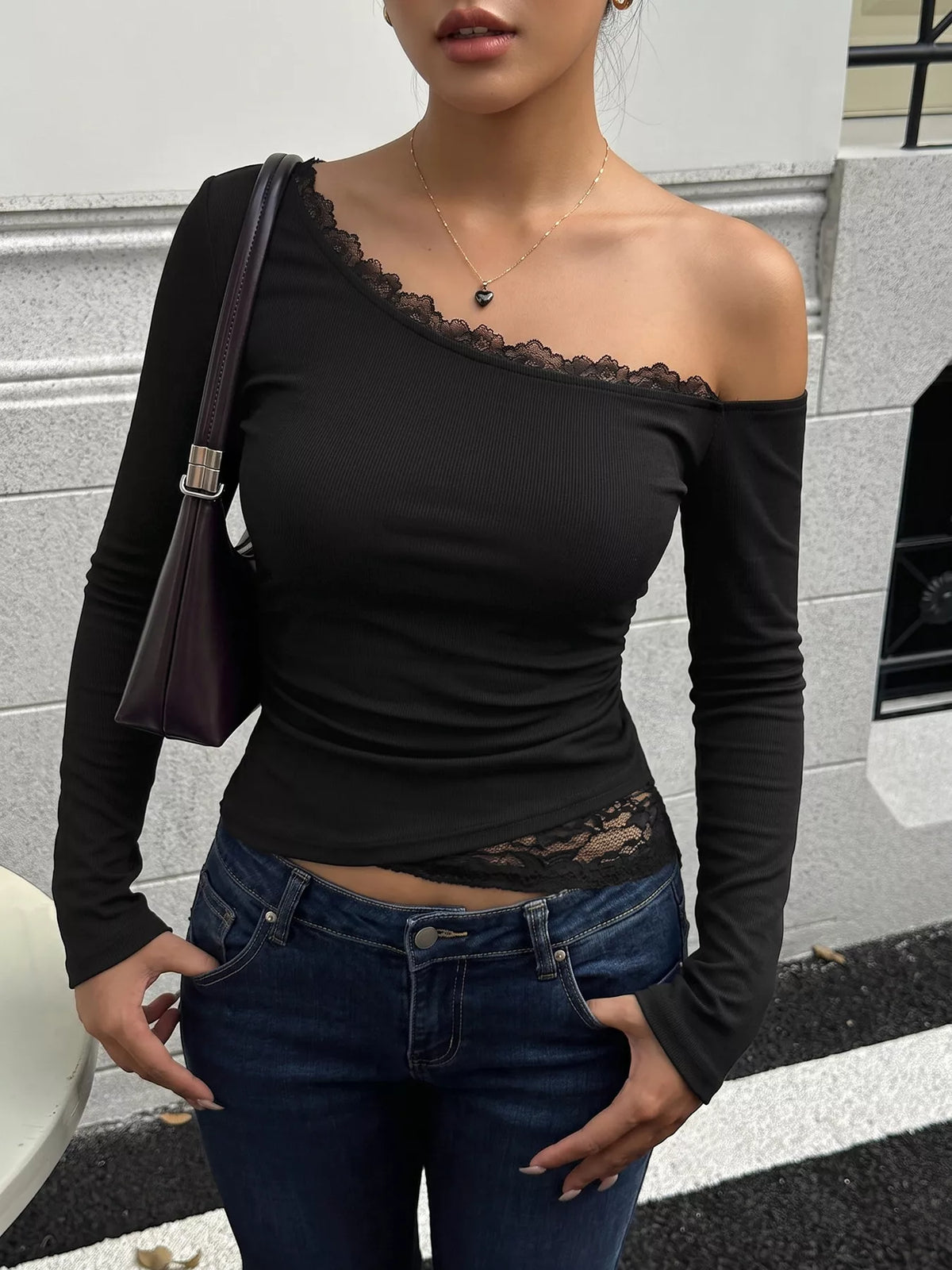 Slim fit one-shoulder lace trim T-shirt from Trendsi, featuring a stylish design and fitted silhouette.