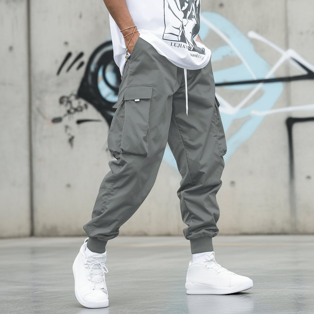 Men’s multi-pocket drawstring cargo pants from Plush Fashion Hub, streetwear style with multiple pockets and a comfortable fit.