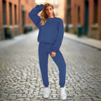Women’s solid color round neck pullover sweatshirt and pants set by Plush Fashion Hub, casualwear with relaxed fit and comfortable fabric.