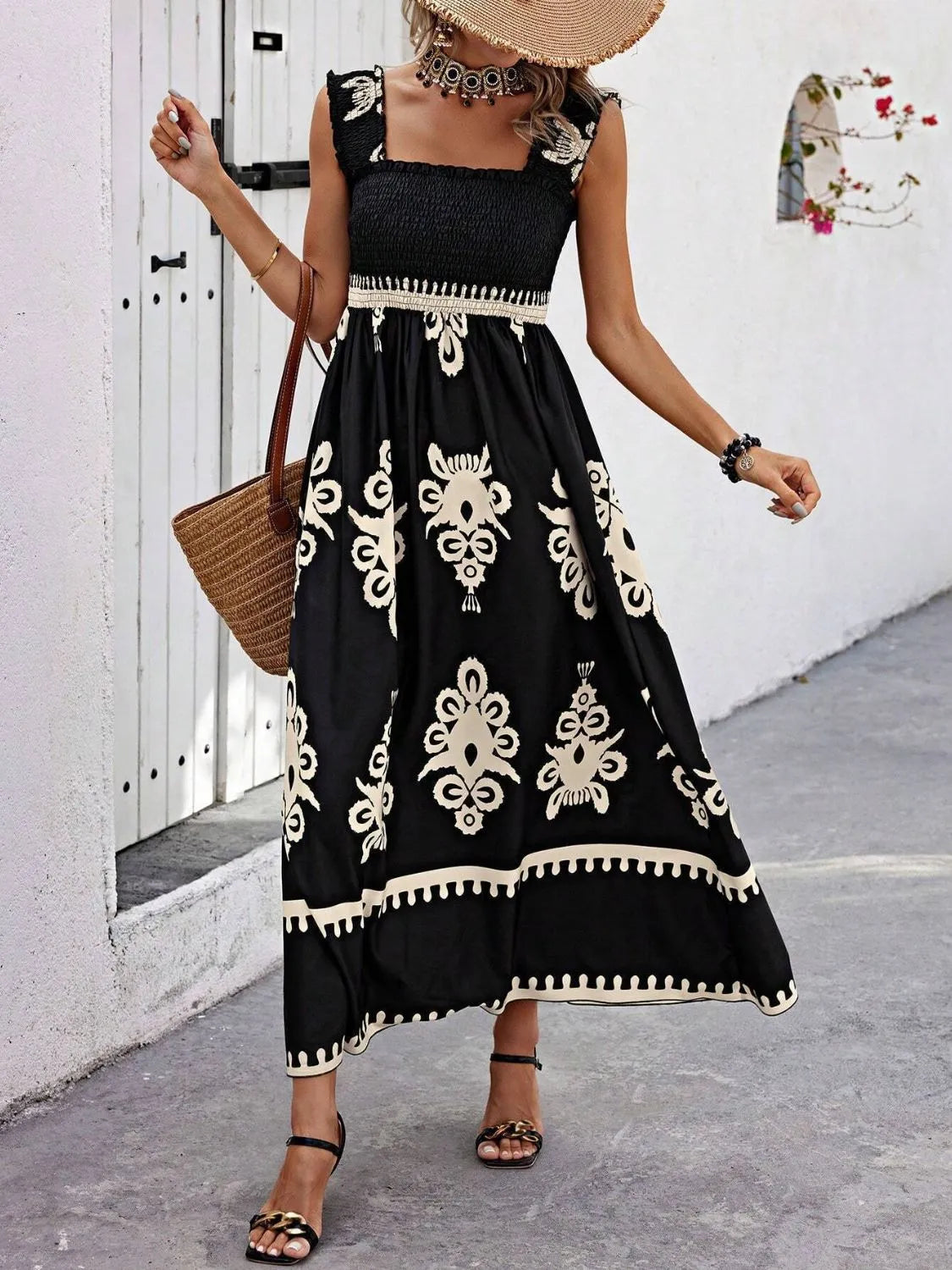 Plush Fashion Hub smocked printed wide strap maxi dress featuring a flowy silhouette and vibrant floral pattern.
