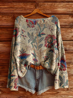 Women’s fall wildflower print long sleeve T-shirt from Plush Fashion Hub, featuring a colorful floral pattern on casual wear.