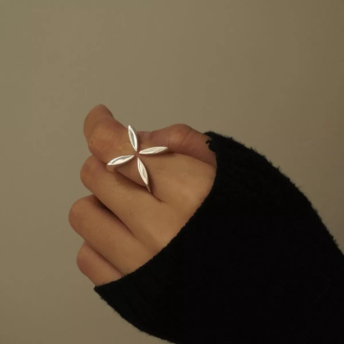 Stainless steel crisscross open ring from Plush Fashion Hub, featuring a sleek, modern design with intersecting band details.