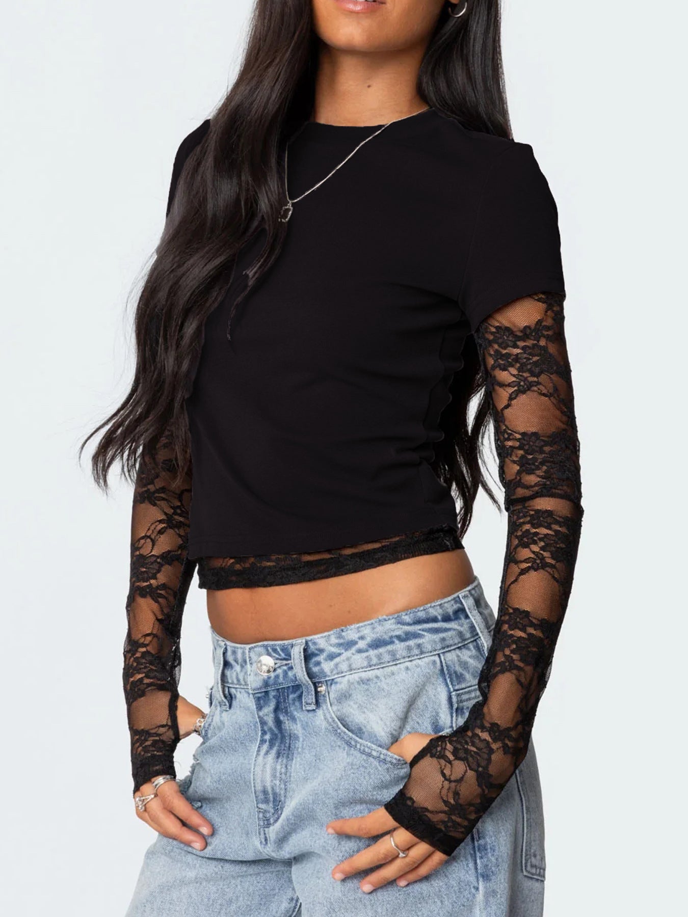 Women's elegant lace sleeve fitted T-shirt by Trendsi, showcasing a sophisticated casual top with lace accents and a sleek fit.