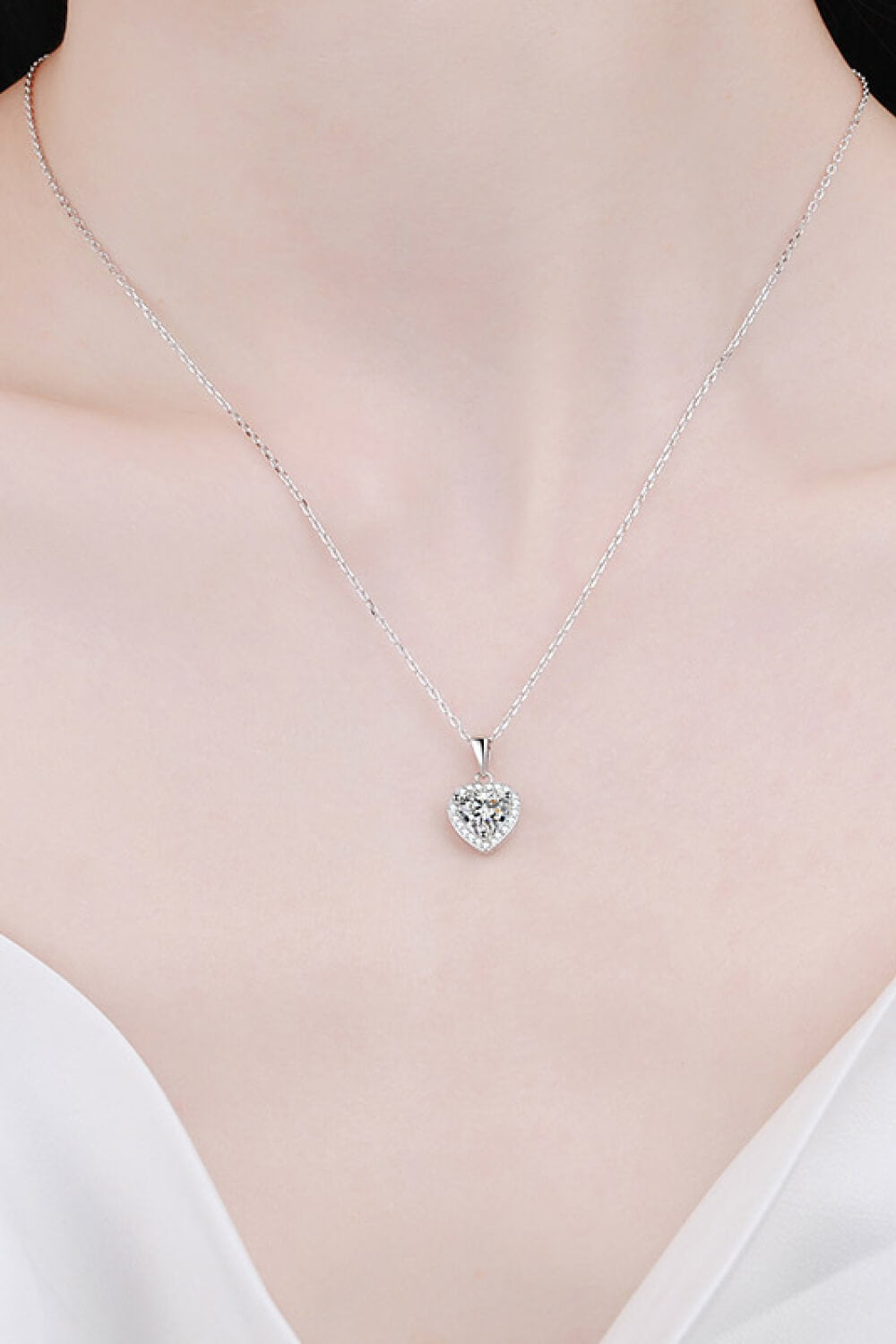1 Carat Moissanite Heart Pendant Necklace on chain, showcasing sparkling gemstone and elegant jewelry design