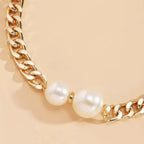 18K gold-plated pearl necklace featuring a string of lustrous pearls and a delicate clasp, elegant jewelry accessory.