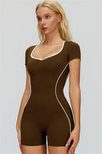 Fitglutes Activewear The Whisper Romper displayed on a model, showcasing its sleek gymwear design and comfortable fit.
