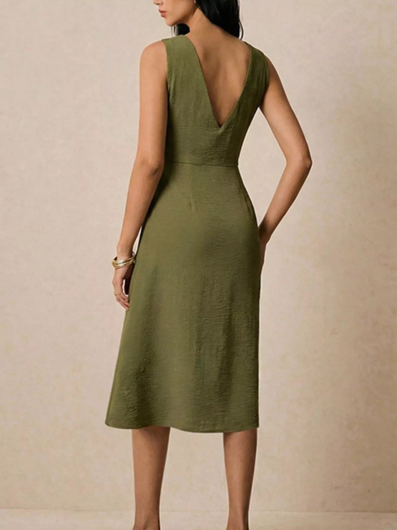 Asymmetrical neck ruched midi dress by Trendsi featuring a fitted silhouette and stylish design, perfect for elegant occasions.