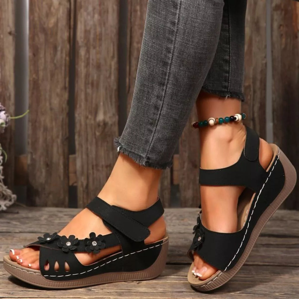 Floral embellished wedge sandals by Shopimist featuring colorful flower details and comfortable cork wedge heel.