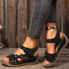 Floral embellished wedge sandals by Shopimist featuring colorful flower details and comfortable cork wedge heel.
