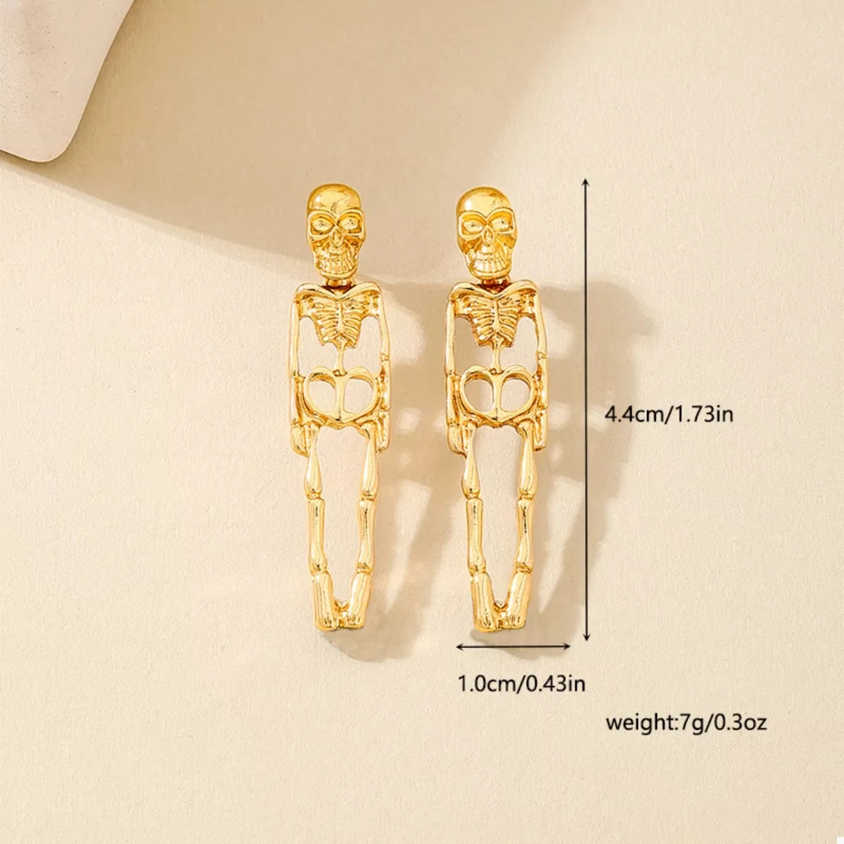 18K gold-plated skeleton earrings for Halloween, featuring detailed skeletal design and gothic style, from Shopimist.