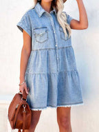 VYSN raw hem short sleeve denim dress displayed on model, casual fashion piece with distressed hem and classic denim styling