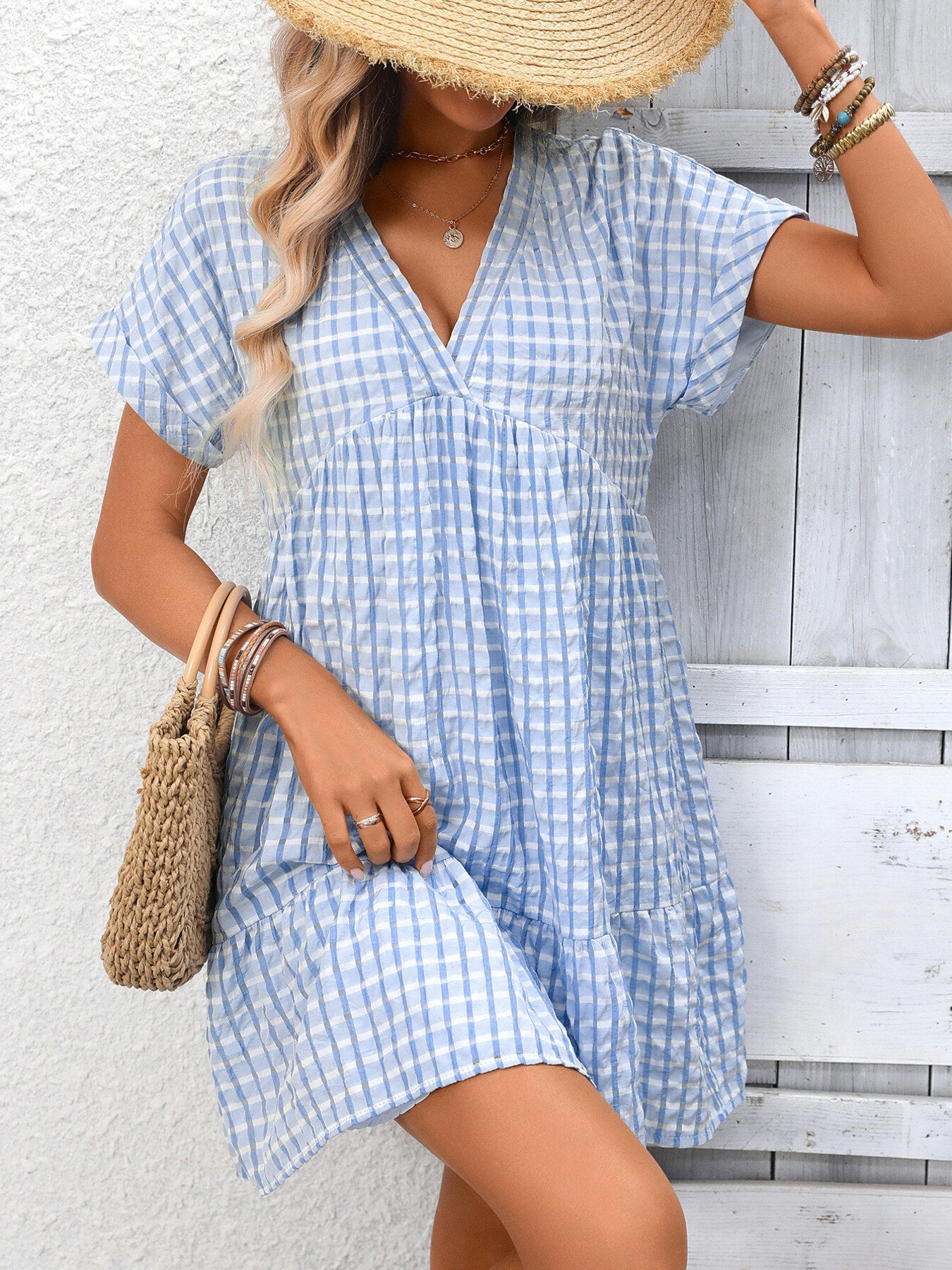 Lightweight plaid V-neck mini dress with ruffle hem from Plush Fashion Hub, perfect for seasonal fashion and casual outings.