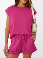 Women's soft round neck cap sleeve lounge set with drawstring shorts from Plush Fashion Hub, shown in a relaxed fit on a model.