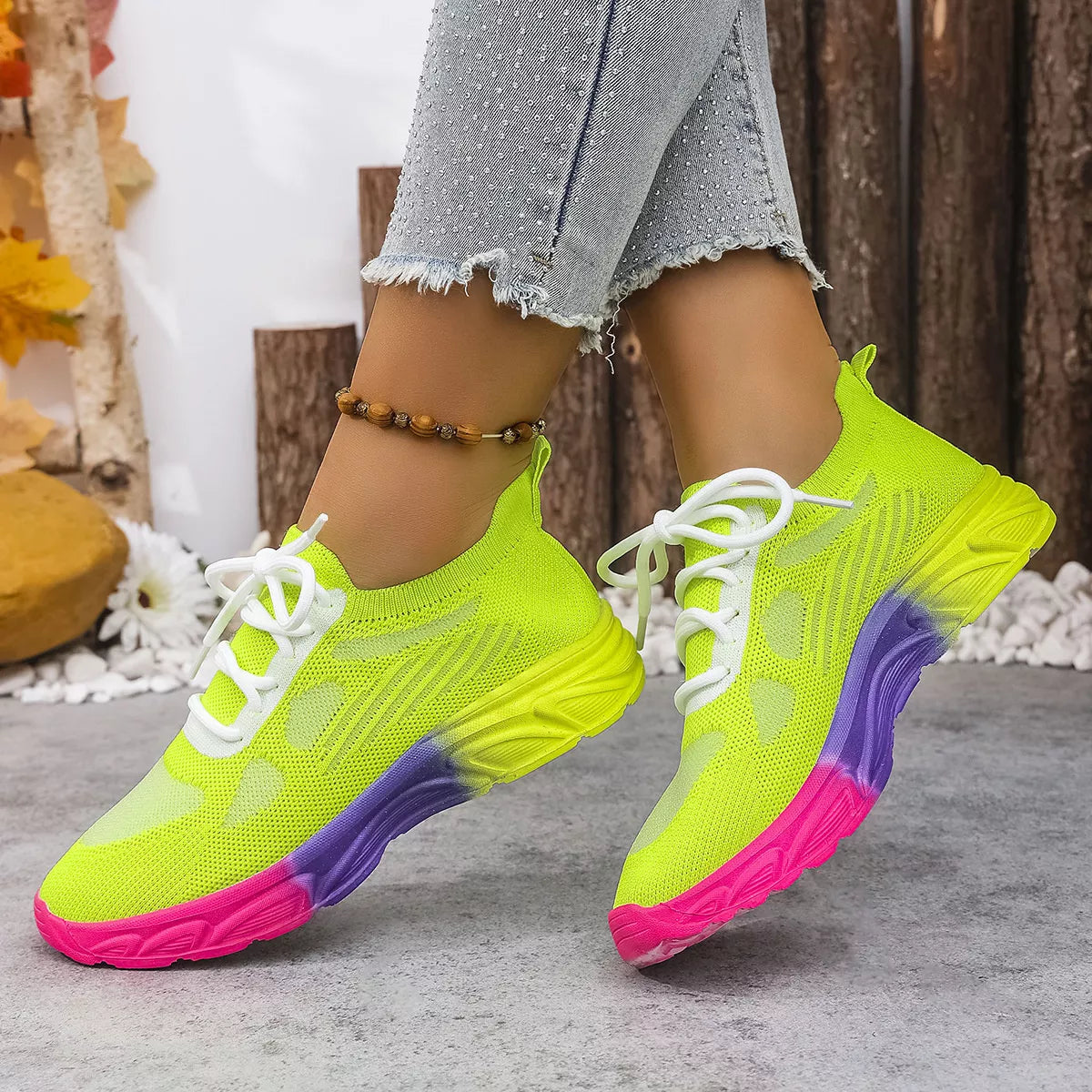 Shopimist lace-up round toe sneakers showing white canvas upper, rubber sole, and classic sneaker design.