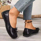 Trendsi bow decor split toe slip-on shoes with stylish design and comfortable fit, shown in a close-up view.