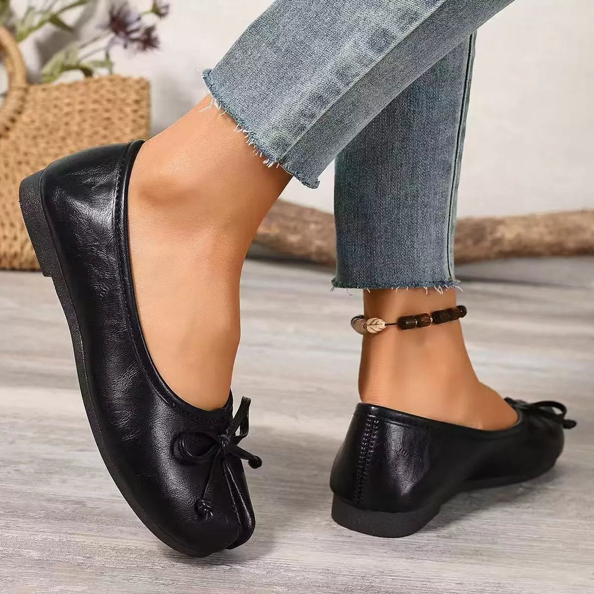Trendsi bow decor split toe slip-on shoes with stylish design and comfortable fit, shown in a close-up view.