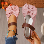 Women's chic bow round toe slip-on flats by Trendsi, made of comfortable vegan leather, featuring a stylish bow detail and easy slip-on design.