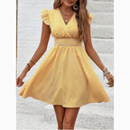 Women's striped V-neck mini dress with flutter sleeves, casual summer dress by Plush Fashion Hub, shown on a model.
