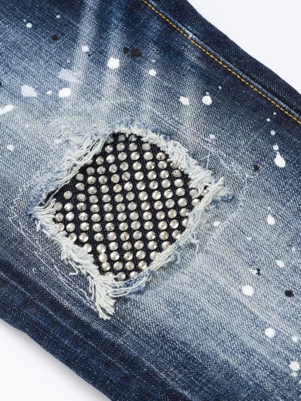 Men's distressed slim fit jeans by Plush Fashion Hub, showcasing a rugged design with faded and torn details.