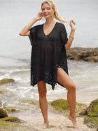 Openwork V-neck slit cover-up from Trendsi featuring lightweight, breathable fabric with a stylish V-neck and side slit detail.