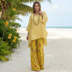 Irregular hem drop-shoulder top and wide-leg pants set by FitiqueFit in three colors, shown on a model.